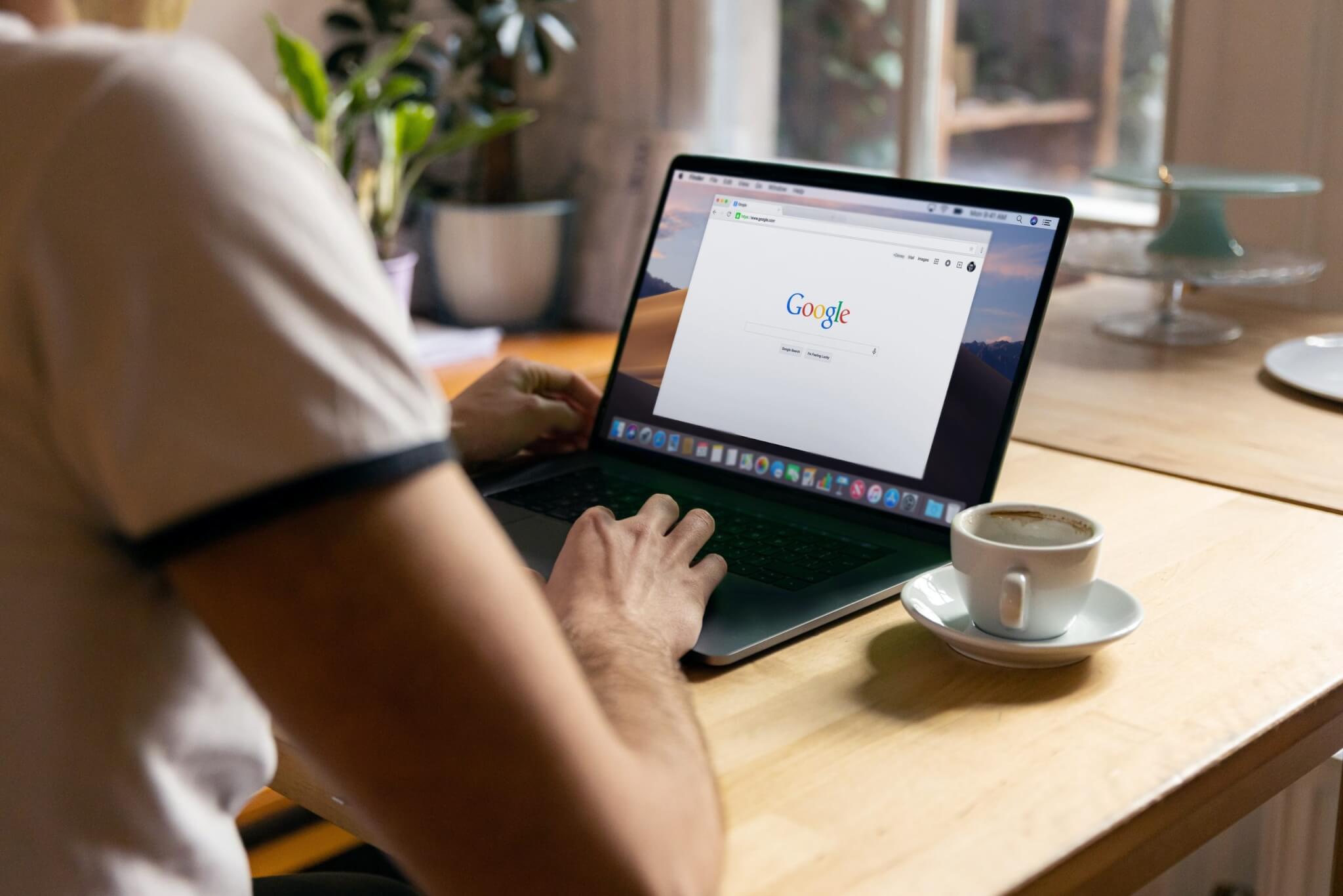 person using black laptop computer with Google Search