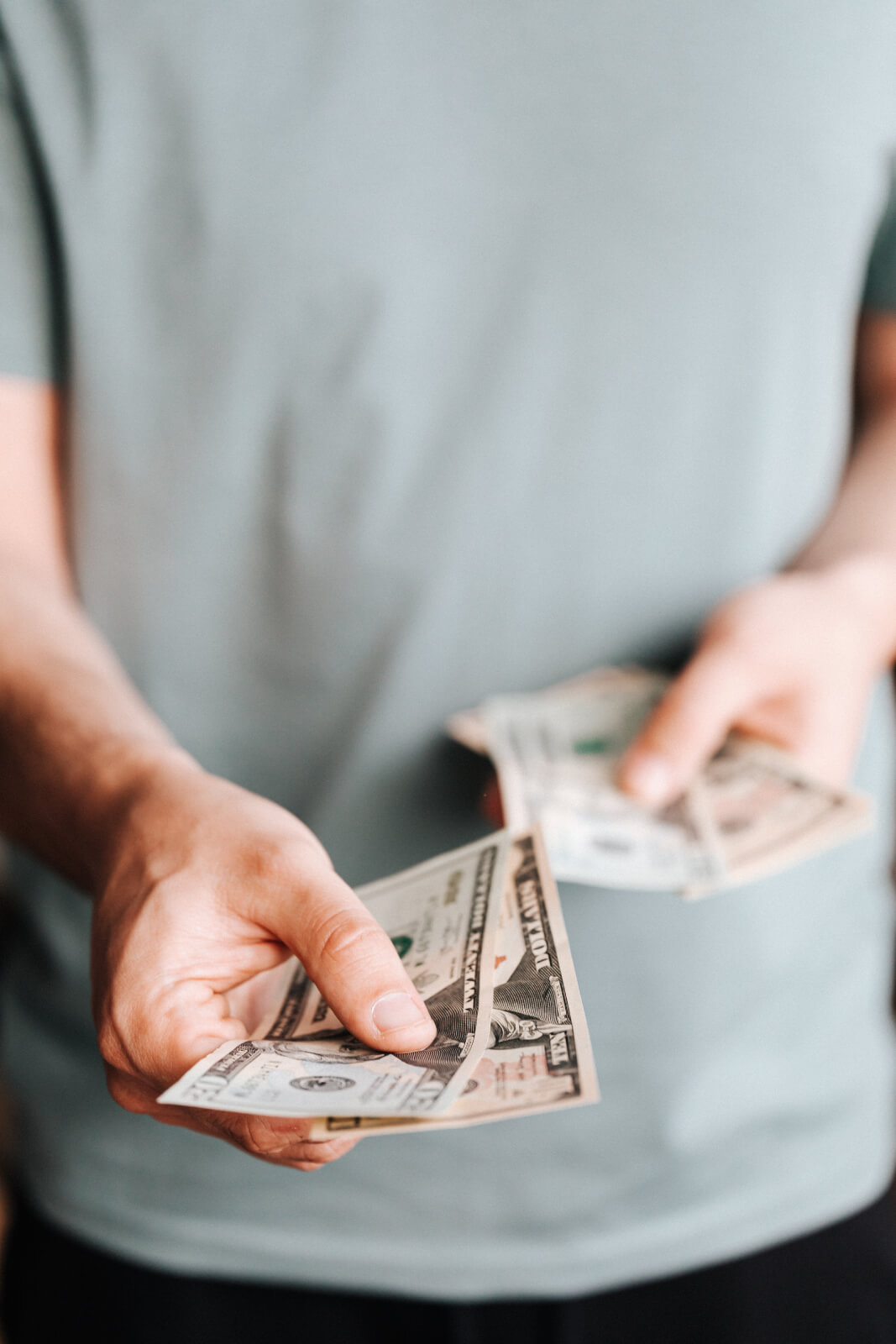 Free Crop man paying with American dollars Stock Photo, Data Breach