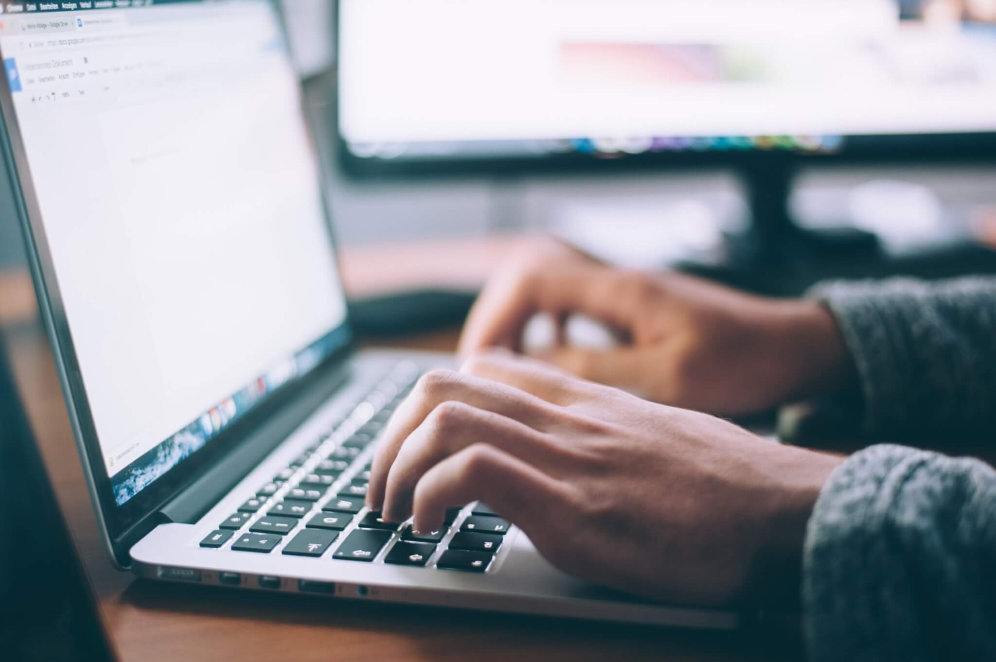person using MacBook Pro, technology