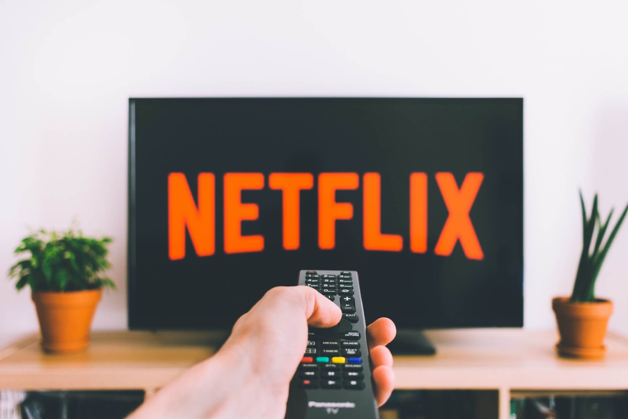 Netflix account hacks, Free Person Holding a Remote Control Stock Photo
