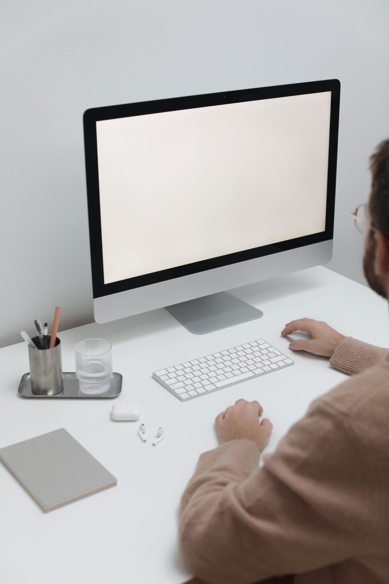 Free Crop man working on computer in workplace Stock Photo, Common Tech Myths