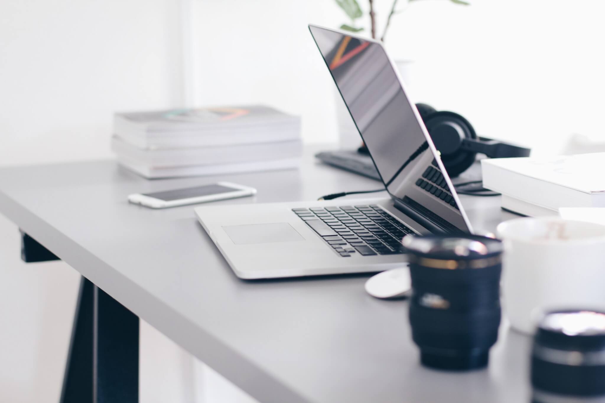 Free Gray Laptop on Table Top Stock Photo, small business technology solutions