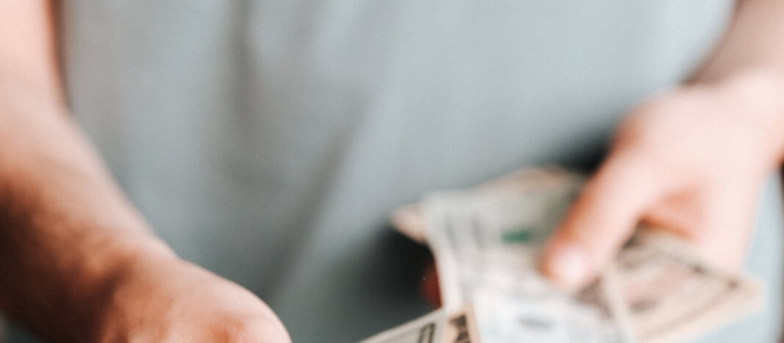 Free Crop man paying with American dollars Stock Photo, Data Breach