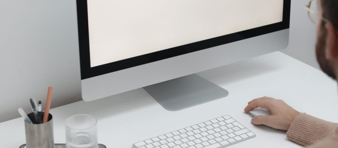 Free Crop man working on computer in workplace Stock Photo, Common Tech Myths