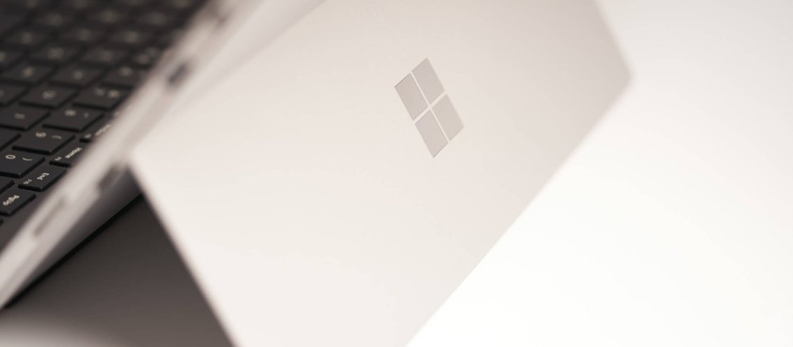 white laptop computer on white table, Microsoft 365 Copilot