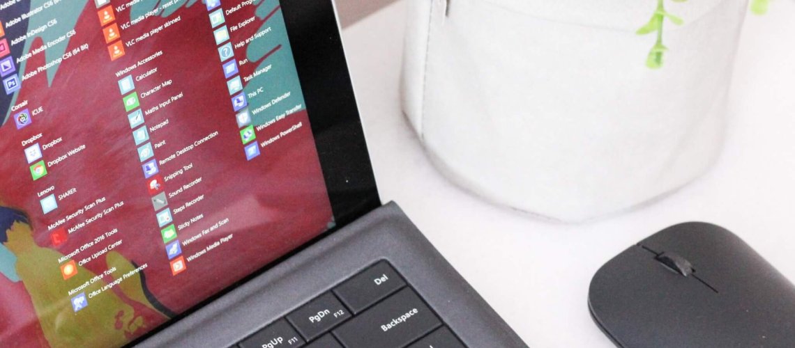 black laptop computer beside black wireless mouse